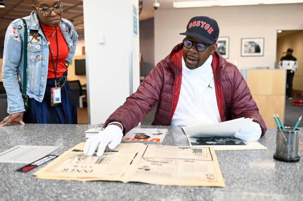 Nwaka Onwusa reviewing archival materials with Bobby Brown at the Rock and Roll Hall of Fame