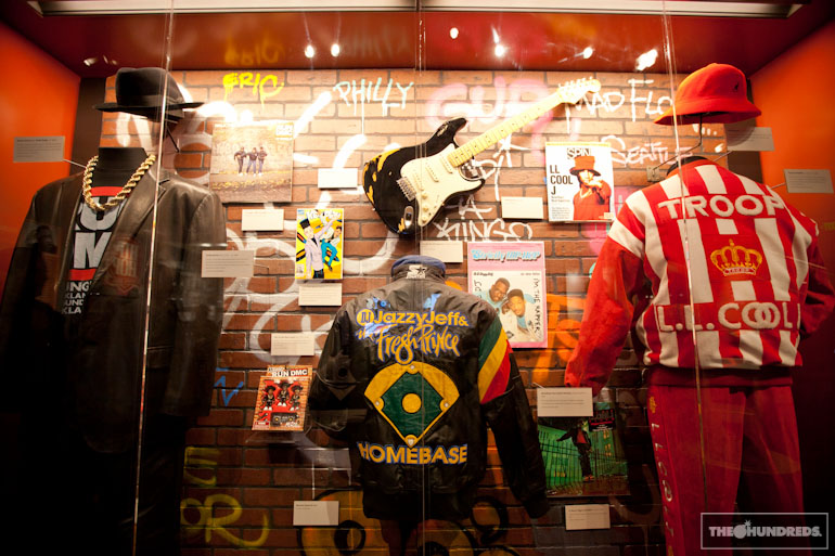 Hip-Hop: A Cultural Odyssey display featuring fashion, instruments, magazines, and artist artifacts