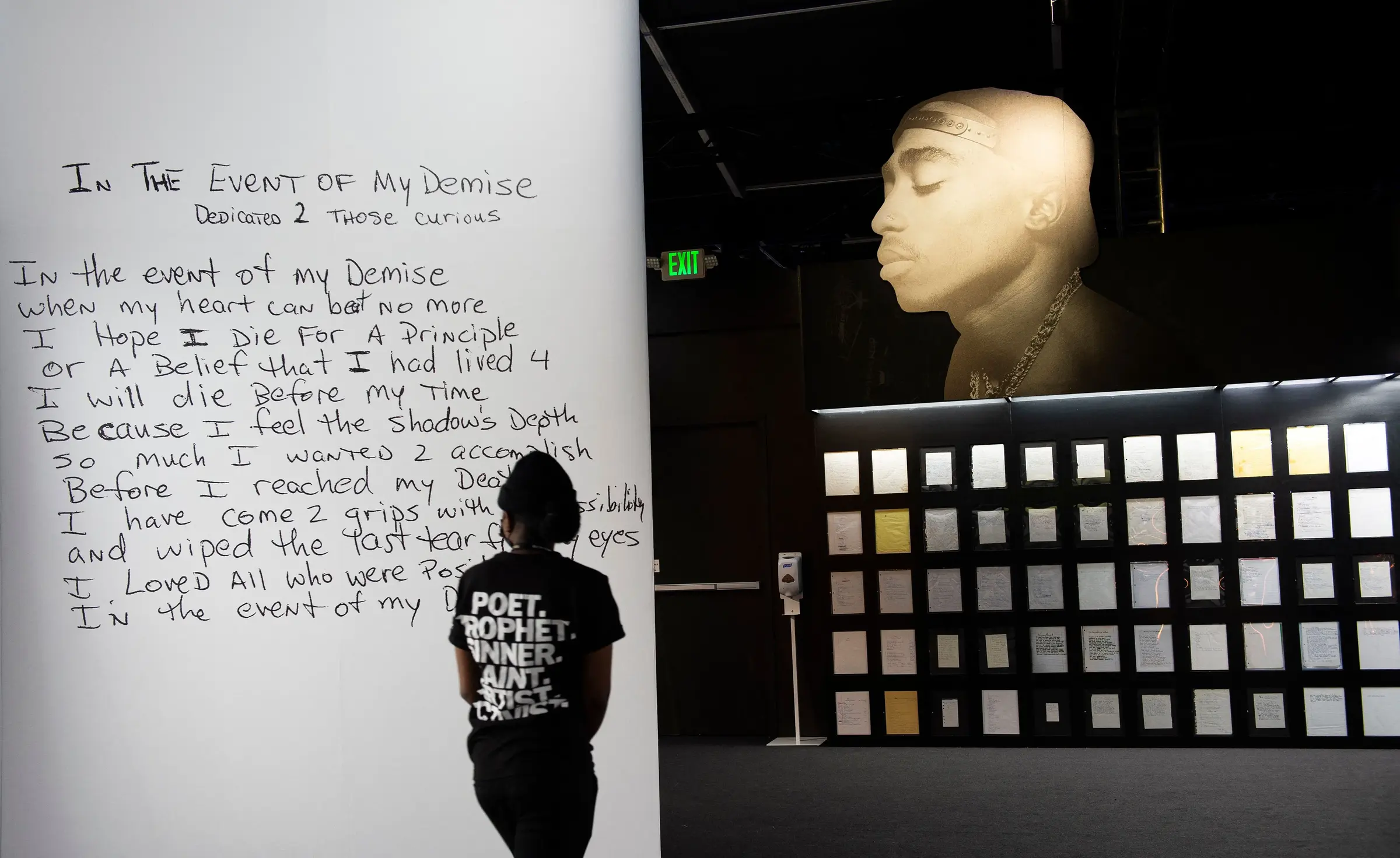 Visitor viewing Tupac Shakur&rsquo;s In the Event of My Demise poem and handwritten archive
